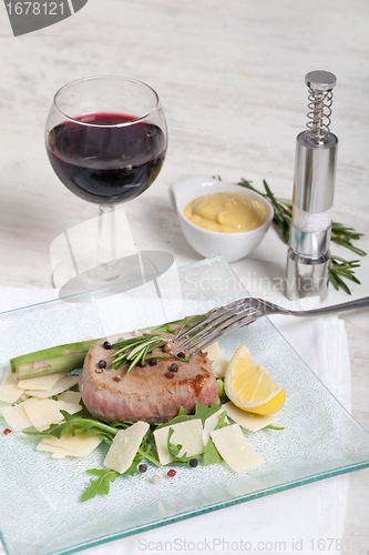 Image of Delicious Beef on arugula salad and parmesan