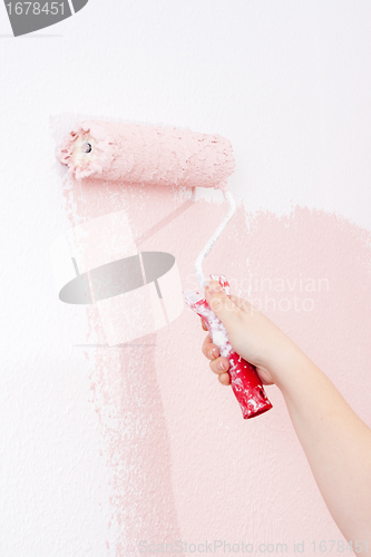 Image of painting a wall in pink