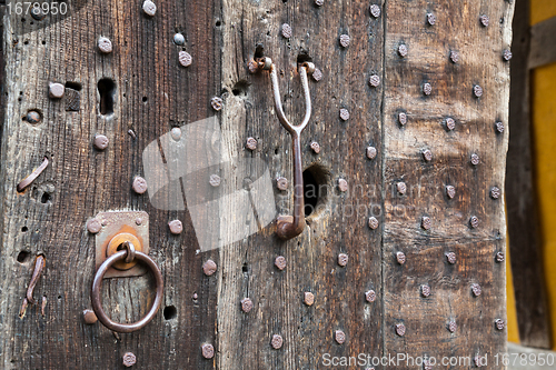 Image of Heavily studded oak door at entrance to castle