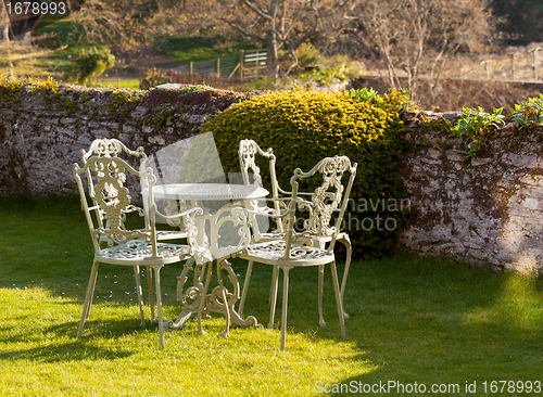 Image of Garden table and chairs on lawn