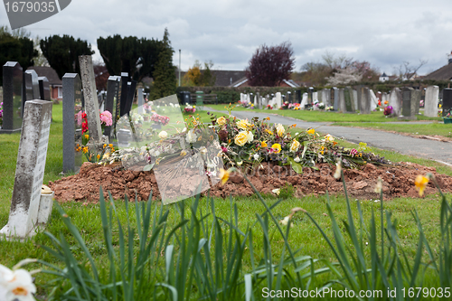 Image of Freshly dug grave in cemetery