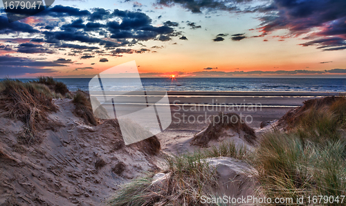 Image of Sunset over Formby Beach through dunes