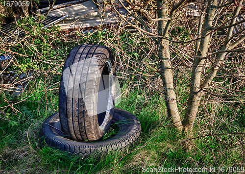 Image of Abandoned car tires on dump