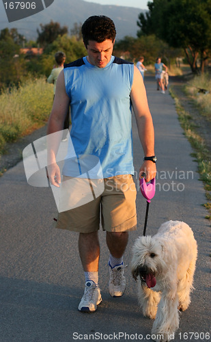 Image of Man walking with his dog