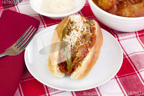 Image of Italian Sausage, onion, and  pepper parmesan sub sandwich.