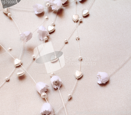 Image of Wedding jewel details. flowers and herats
