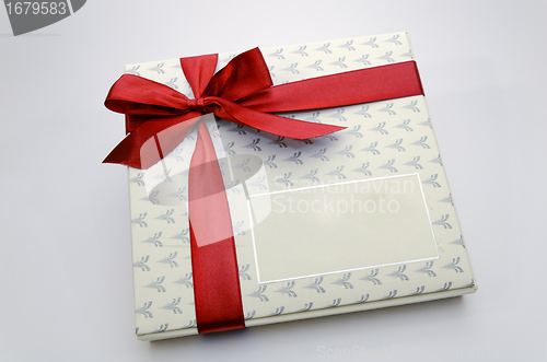 Image of Printed over a red ribbon gift box