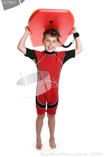 Image of Child carrying a surfboard