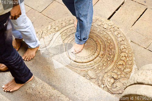 Image of "moon" stone at the entrance to the buddhist temple