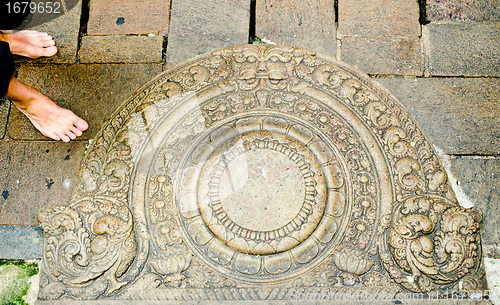 Image of "moon" stone at the entrance to the buddhist temple