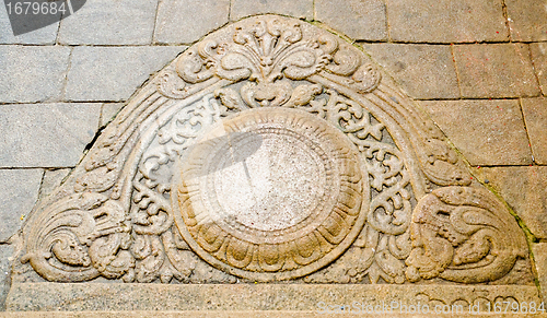 Image of "moon" stone at the entrance to the buddhist temple