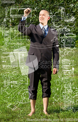 Image of Businessman Writing Something Outdoors