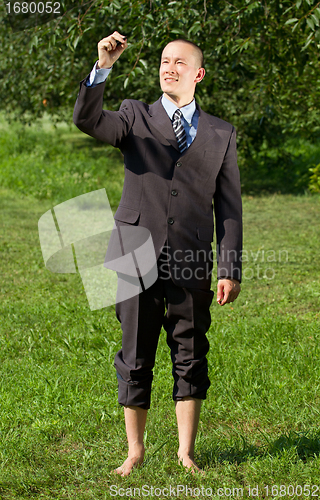 Image of Businessman Writing Something Outdoors