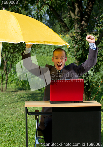 Image of Businessman Working Outdoors