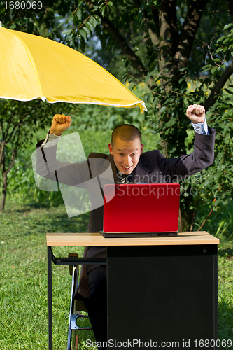 Image of Businessman Working Outdoors