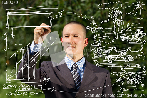 Image of Businessman Writing Something Outdoors