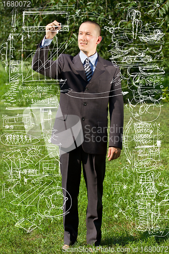 Image of Businessman Writing Something Outdoors