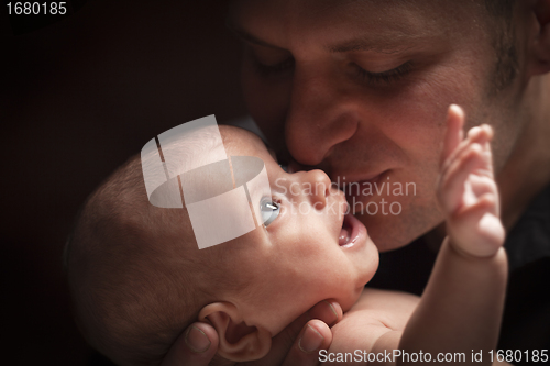 Image of Young Father Holding His Mixed Race Newborn Baby