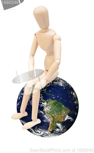 Image of Wooden Puppet on Globe