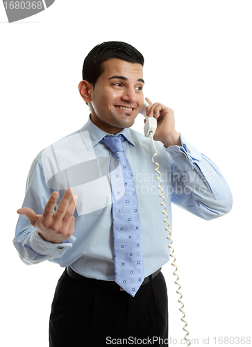 Image of Businessman in discussion on telephone