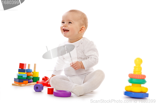 Image of Small child play with toys on white background