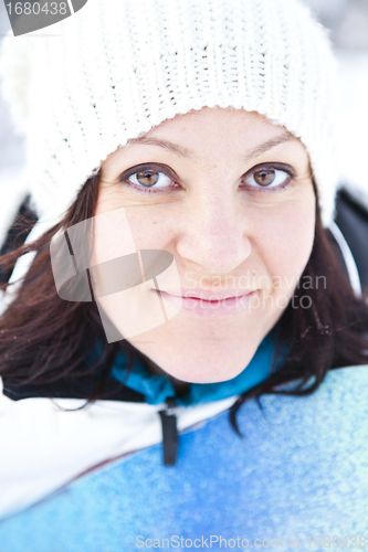 Image of Winter woman with snowboard