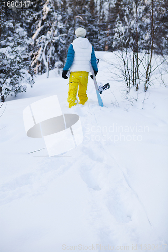 Image of Winter woman with snowboard