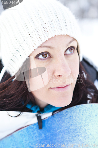 Image of Winter woman with snowboard