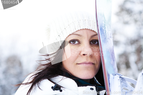 Image of Winter woman with snowboard