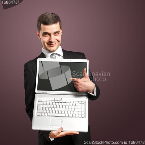 Image of Businessman With Open Laptop In His Hands