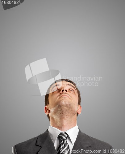 Image of Businessman Looking Upwards