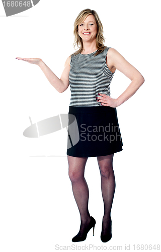Image of Beautiful woman presenting copy space