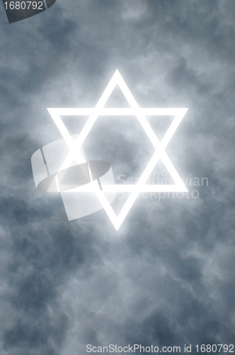 Image of Glowing Star of David in clouds