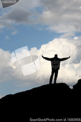 Image of silhouette of a man in front of the blue sky