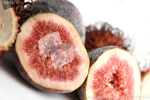 Image of exotic fruits compilation: rambutan and fig