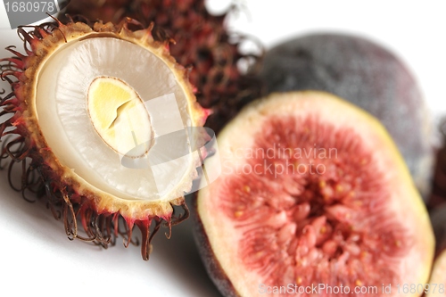 Image of exotic fruits compilation: rambutan and fig