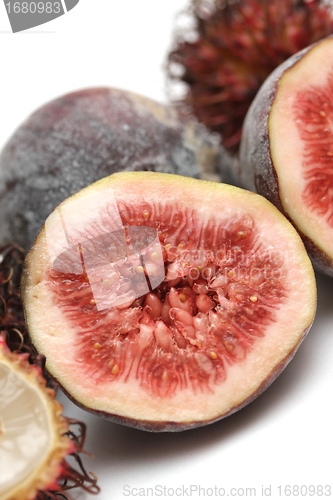 Image of exotic fruits compilation: rambutan and fig