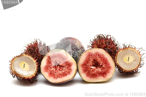 Image of exotic fruits compilation: rambutan and fig