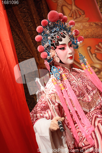 Image of chinese opera dummy and red cloth as text space ,it is a toy,not