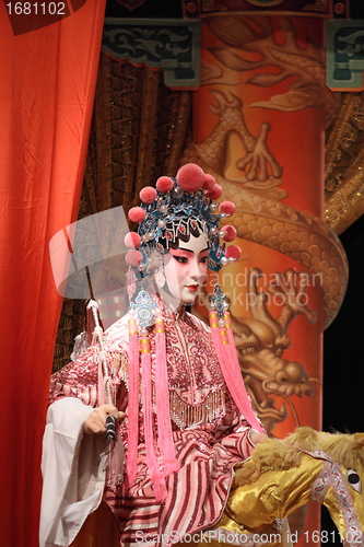 Image of chinese opera dummy and red cloth as text space ,it is a toy,not