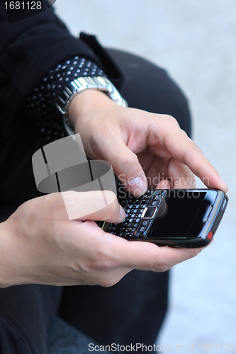 Image of Mobile phone in man hand