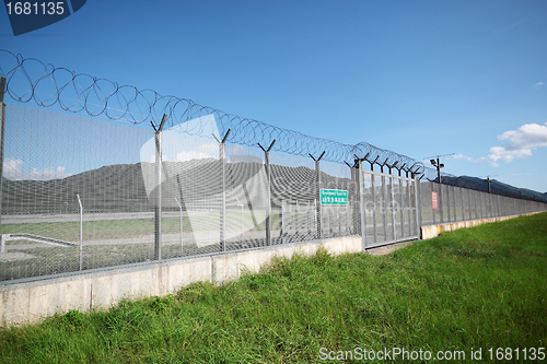 Image of palisade on green yellow meadow 