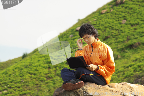 Image of asain Man with notebook 