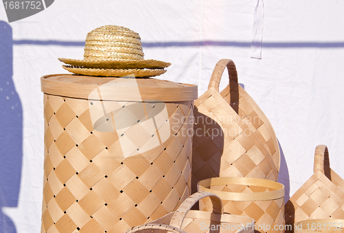 Image of wicker wooden baskets and hats sold at market fair 
