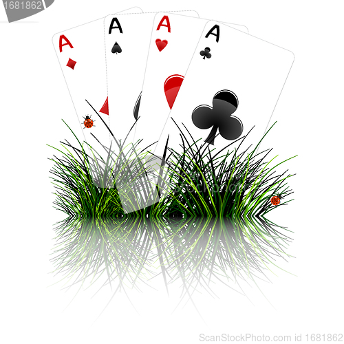 Image of four aces behind grass reflected