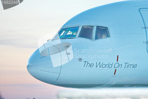 Image of Front profile and cockpit windows of wide-body airplane