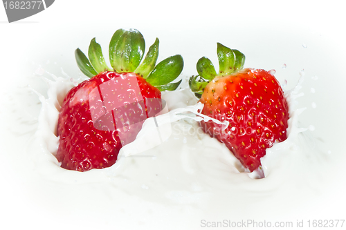 Image of strawberry splashing into milk