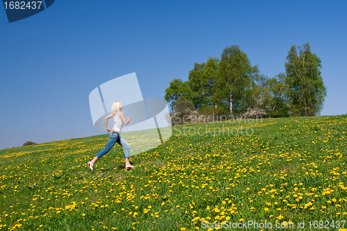 Image of happy young woman on meadow