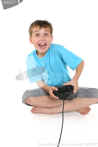 Image of Excited boy playing a computer game