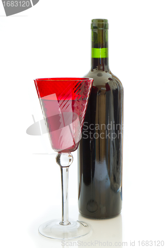 Image of red wine bottle with glass